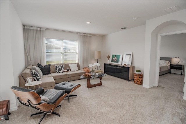 living room with light colored carpet