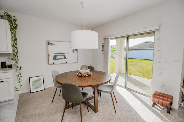 view of carpeted dining area