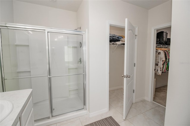 bathroom featuring vanity, tile patterned flooring, and an enclosed shower