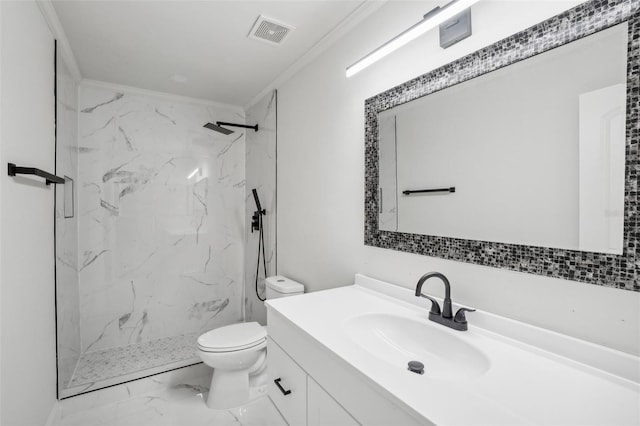 bathroom featuring vanity, toilet, ornamental molding, and a tile shower