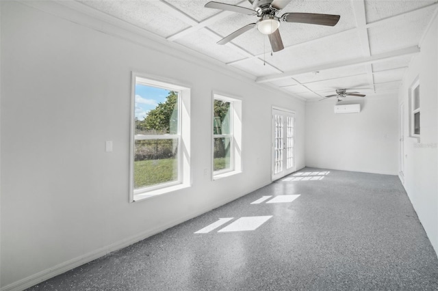 spare room with french doors, an AC wall unit, and ceiling fan