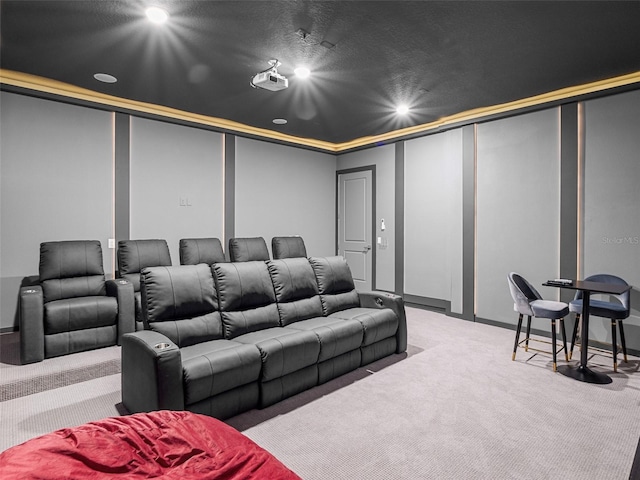 cinema room featuring light colored carpet