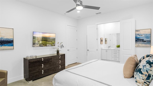 tiled bedroom featuring ensuite bath and ceiling fan