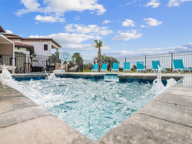 view of pool with pool water feature