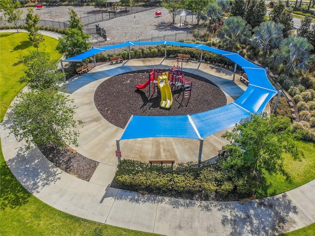 exterior space with a lawn and a playground