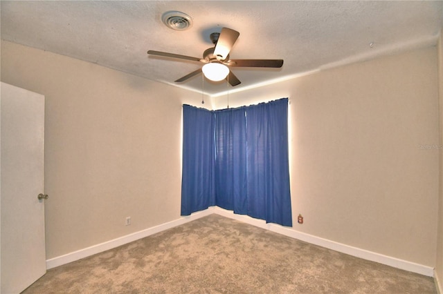 empty room with ceiling fan and carpet flooring