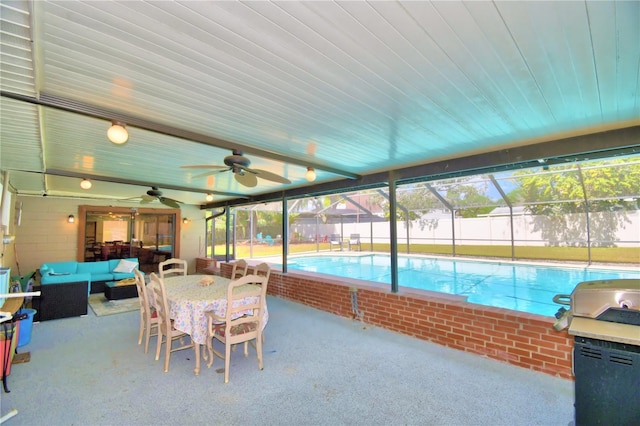 view of pool featuring outdoor lounge area, ceiling fan, a lanai, and a patio area