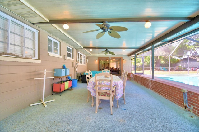 sunroom / solarium featuring ceiling fan