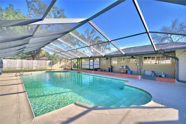 view of pool featuring a patio, a lanai, and ceiling fan