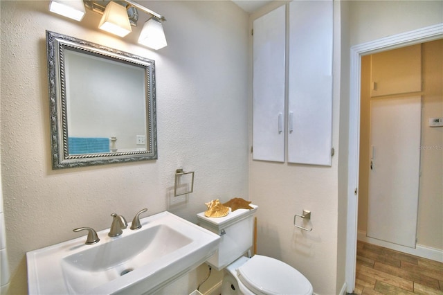 bathroom with sink and toilet