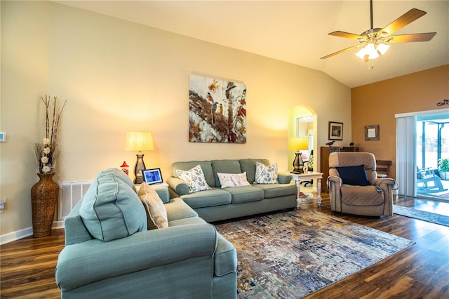 living room with dark hardwood / wood-style floors, ceiling fan, and vaulted ceiling