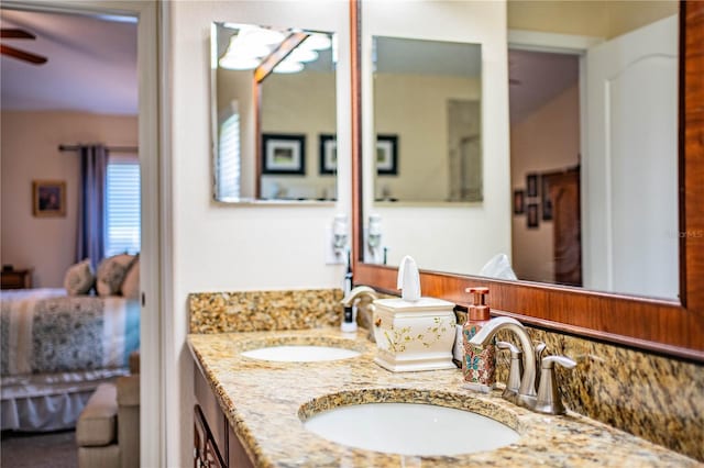 bathroom with vanity, decorative backsplash, and ceiling fan