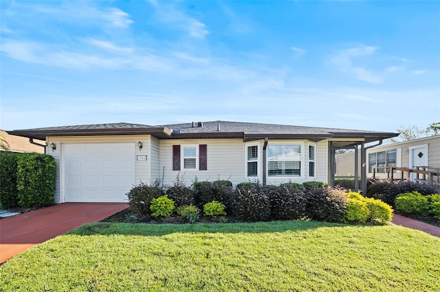 single story home with a garage and a front lawn