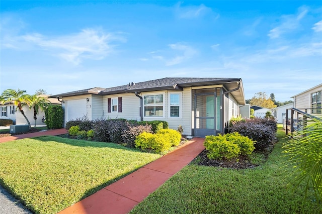 view of front facade with a garage and a front yard