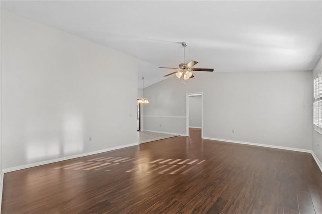 unfurnished living room with baseboards, vaulted ceiling, wood finished floors, and ceiling fan with notable chandelier