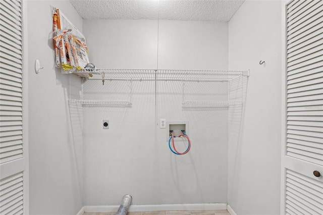 washroom with laundry area, washer hookup, a textured ceiling, and hookup for an electric dryer