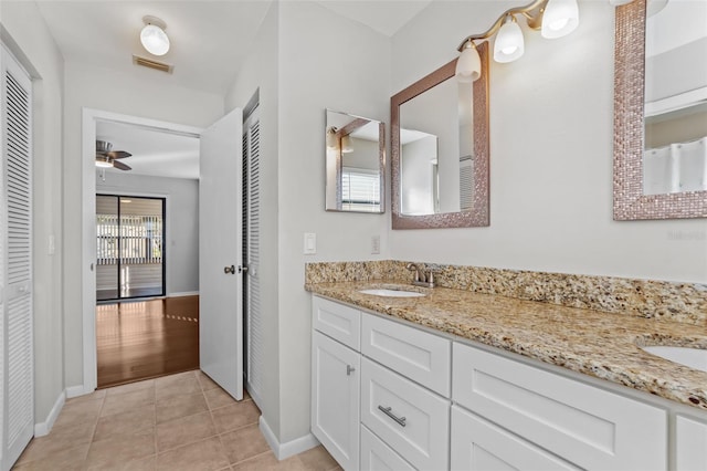 bathroom featuring vanity, tile patterned flooring, and ceiling fan