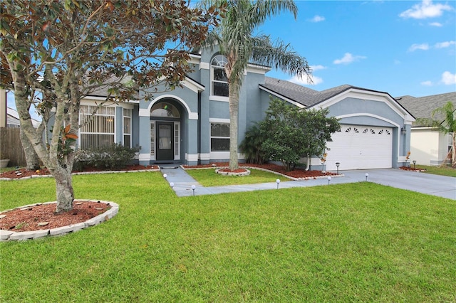 view of front facade with a garage and a front lawn