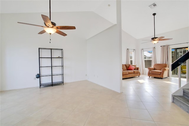 unfurnished living room featuring ceiling fan, high vaulted ceiling, and light tile patterned floors