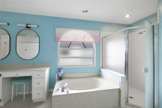 bathroom with vanity, plus walk in shower, a textured ceiling, and tile patterned floors