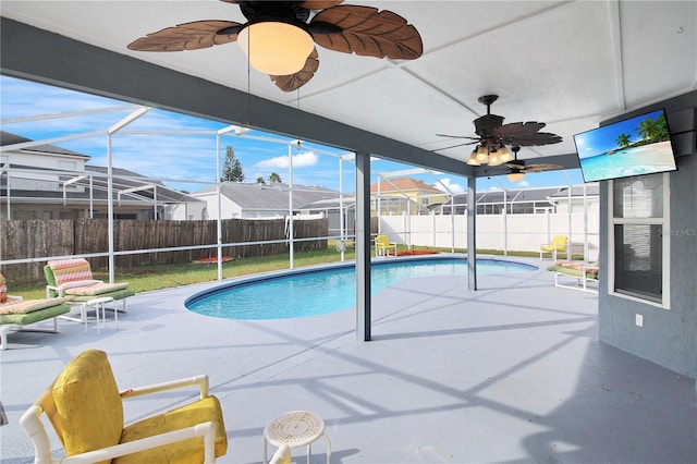 view of pool featuring a patio, a lanai, and ceiling fan