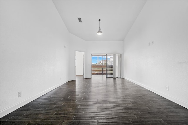 unfurnished living room with lofted ceiling and dark hardwood / wood-style floors