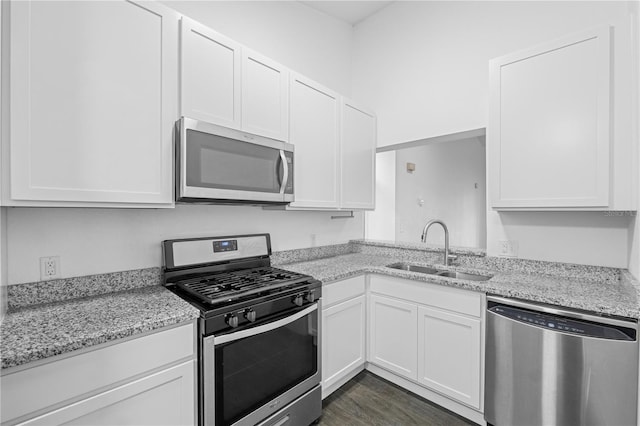 kitchen featuring appliances with stainless steel finishes and white cabinets