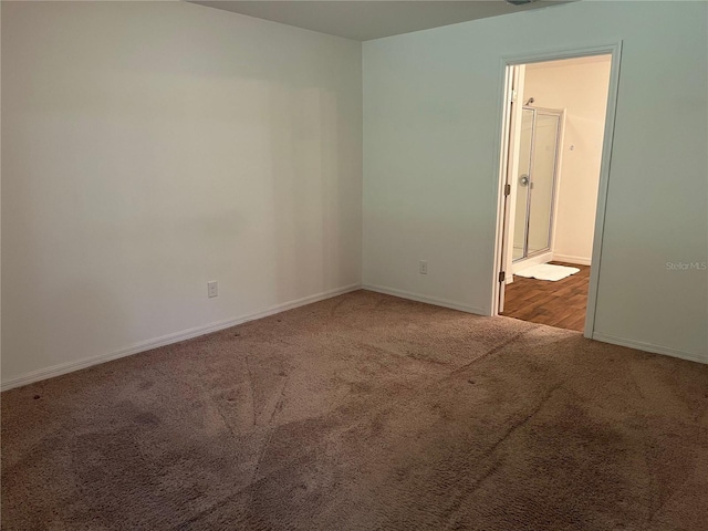 empty room with light colored carpet