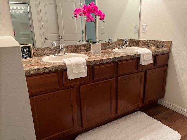 bathroom with vanity and hardwood / wood-style floors