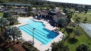 community pool featuring a patio and fence