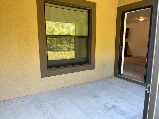 exterior space featuring stucco siding