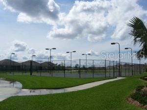 surrounding community featuring fence and a lawn