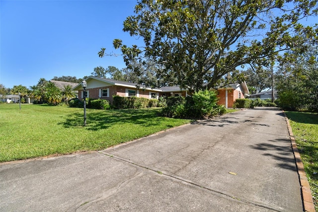 ranch-style house with a front lawn