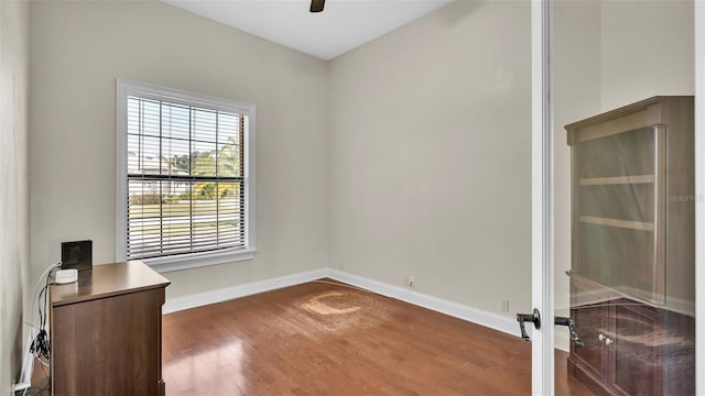 interior space with dark hardwood / wood-style floors and ceiling fan