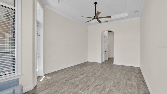 interior space with crown molding, ceiling fan, and light hardwood / wood-style flooring