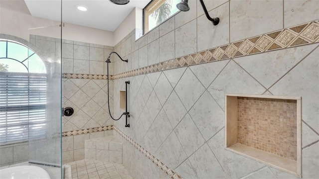 bathroom with a tile shower