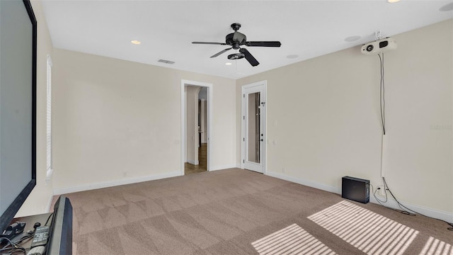 carpeted empty room with ceiling fan