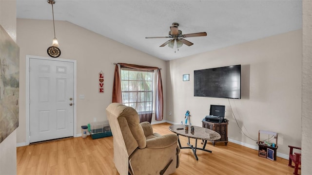 sitting room featuring ceiling fan, lofted ceiling, and hardwood / wood-style floors