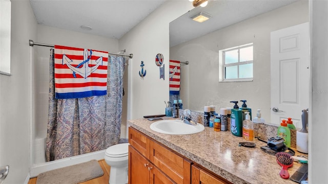 bathroom with vanity, toilet, a shower with curtain, and hardwood / wood-style floors