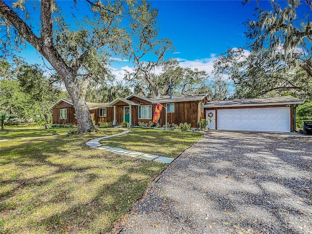 ranch-style house with a front lawn and a garage