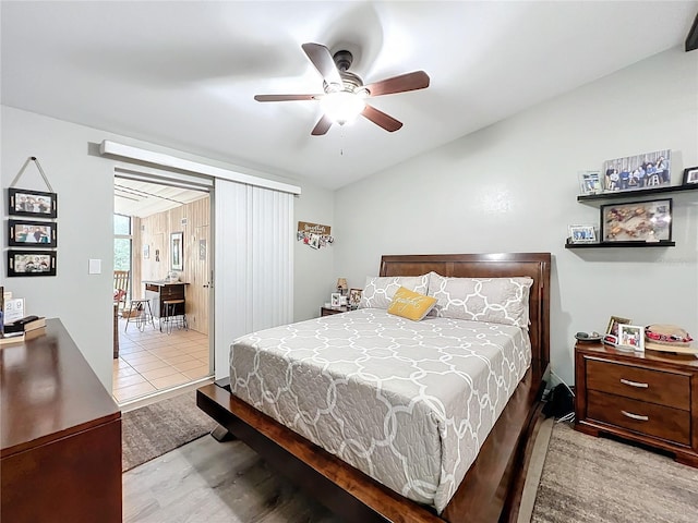 bedroom with light hardwood / wood-style floors and ceiling fan