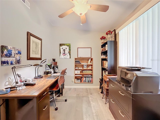 office with light hardwood / wood-style flooring, lofted ceiling, and ceiling fan