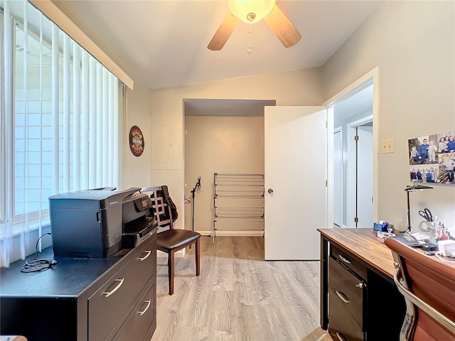 office area with light hardwood / wood-style flooring, lofted ceiling, ceiling fan, and a wealth of natural light