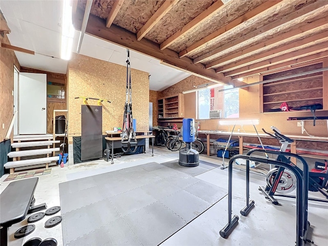 exercise area with lofted ceiling