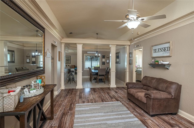 living room with hardwood / wood-style flooring, ornamental molding, decorative columns, and ceiling fan with notable chandelier