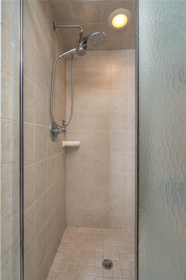 bathroom with tiled shower