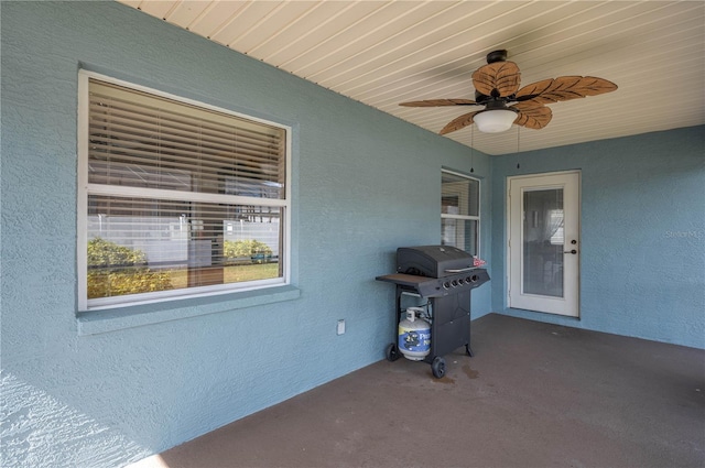 view of patio featuring ceiling fan and grilling area