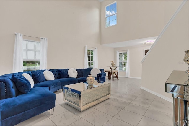 living room with a towering ceiling