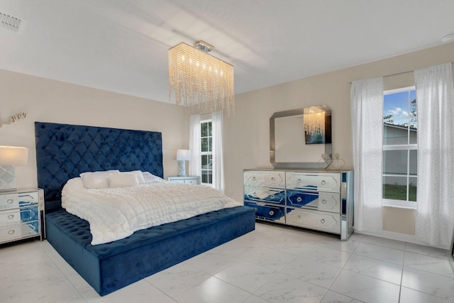 bedroom with a notable chandelier