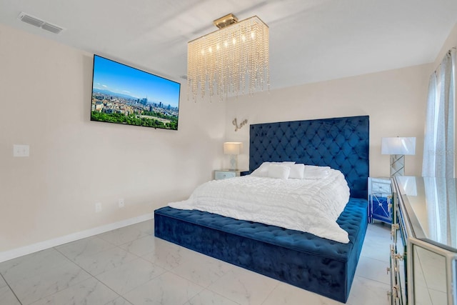 bedroom with a chandelier